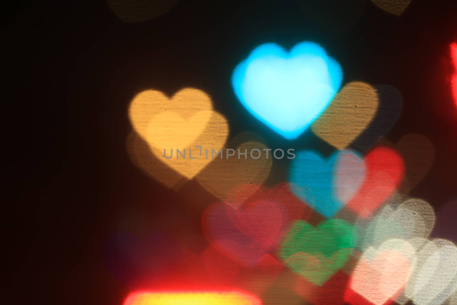 colorful heart-shaped on black background, lighting bokeh for wallpaper, blurred bokeh for valentine's day background, love pictures background, lighting heart shape soft at night time by cgdeaw