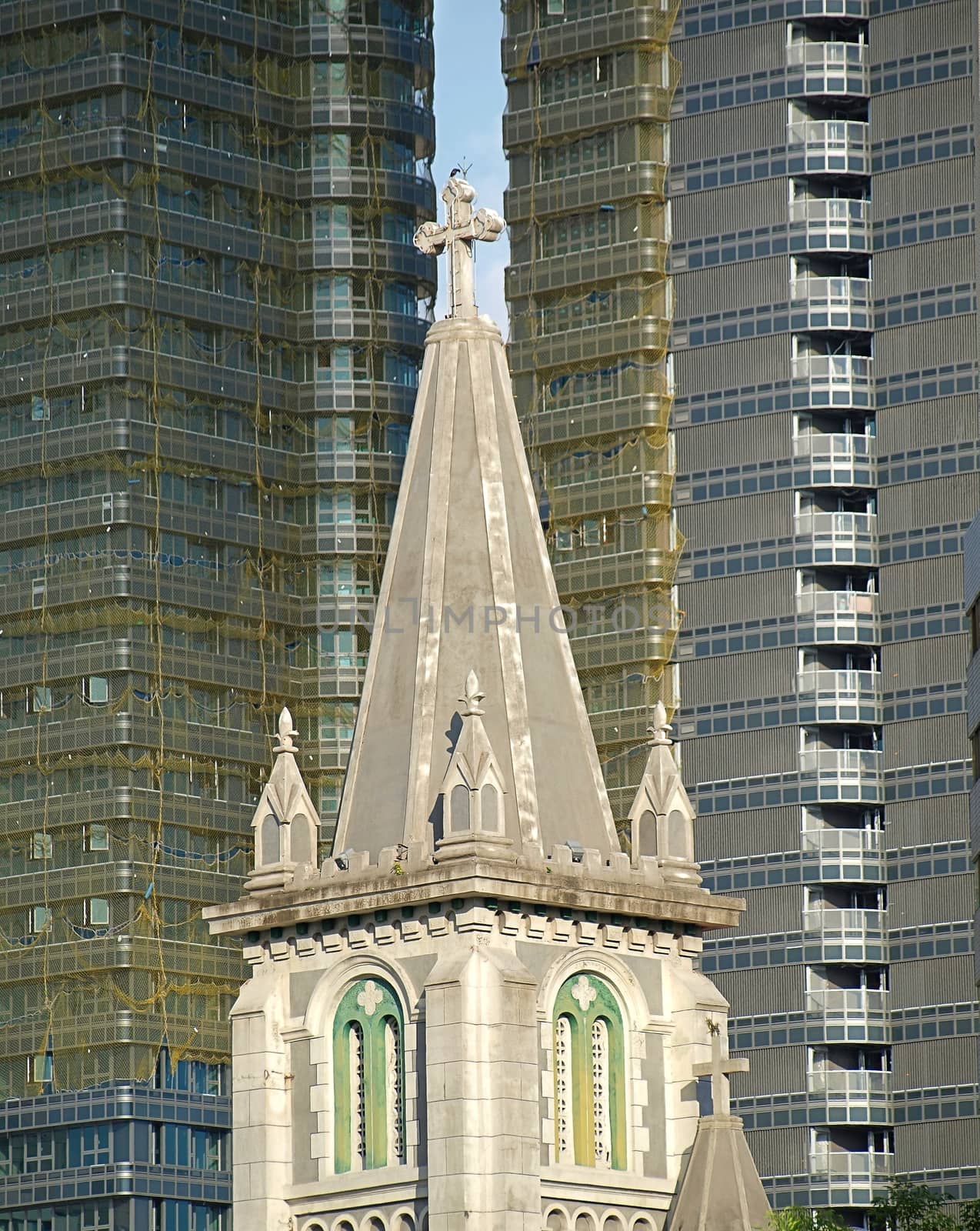 An old church building from 150 years ago is surrounded by modern buildings
