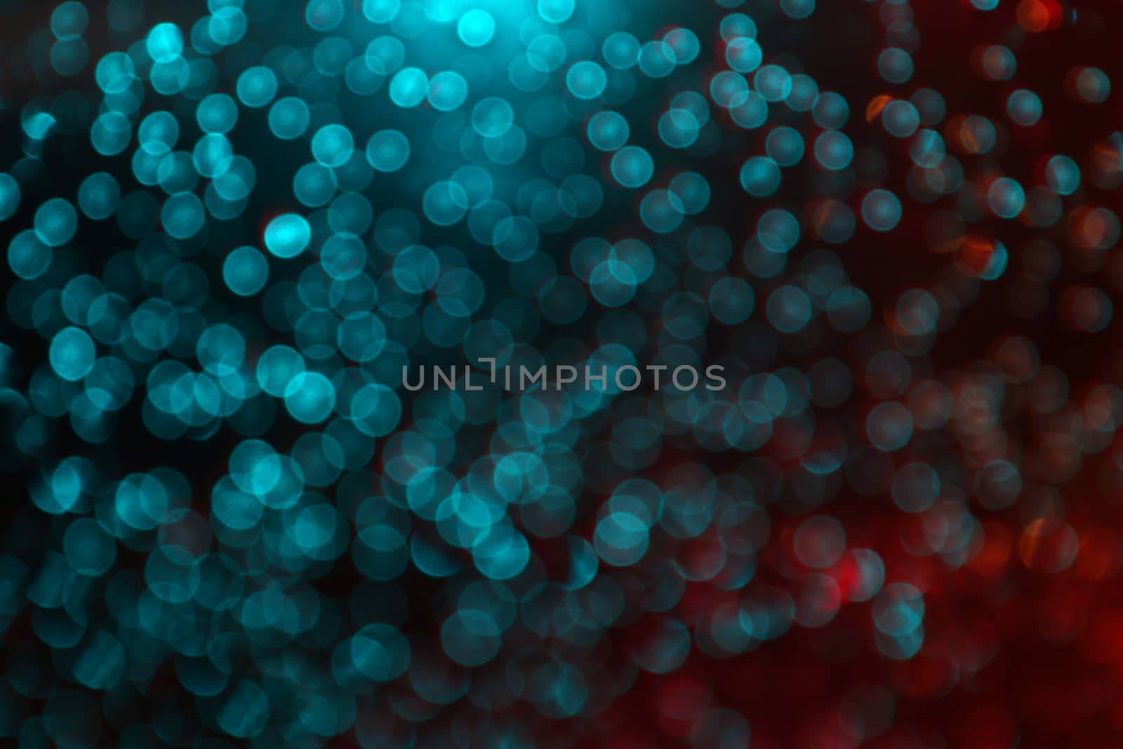 Abstract blurred Bokeh light blue and red glittering for night background