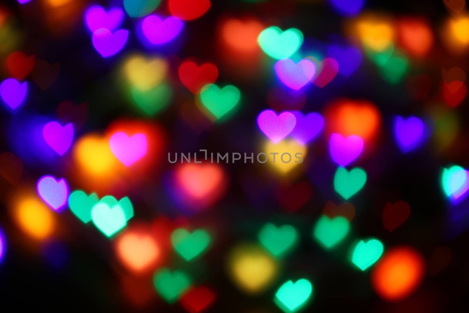 Valentines Colorful heart-shaped bokeh on black background lighting bokeh for decoration at night backdrop wallpaper blur valentine, Love Pictures background, Lighting heart shaped soft night abstract