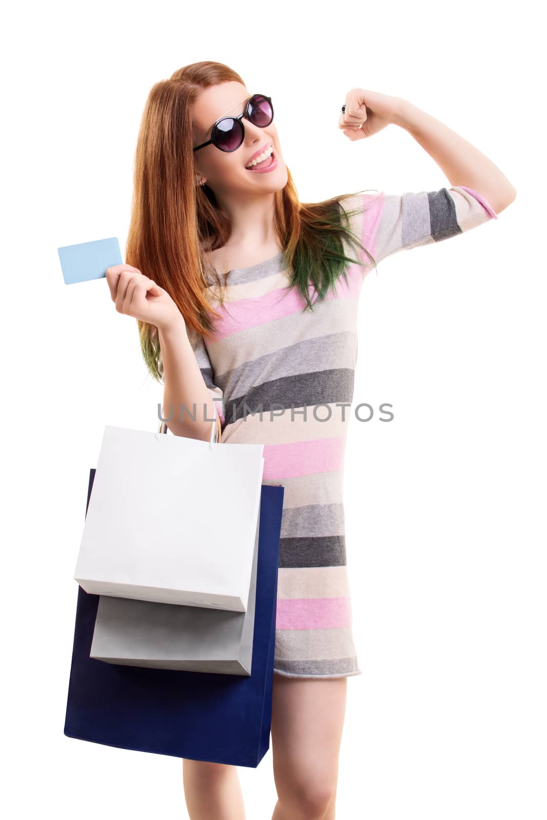 Excited girl holding shopping bags and a blank card by Mendelex