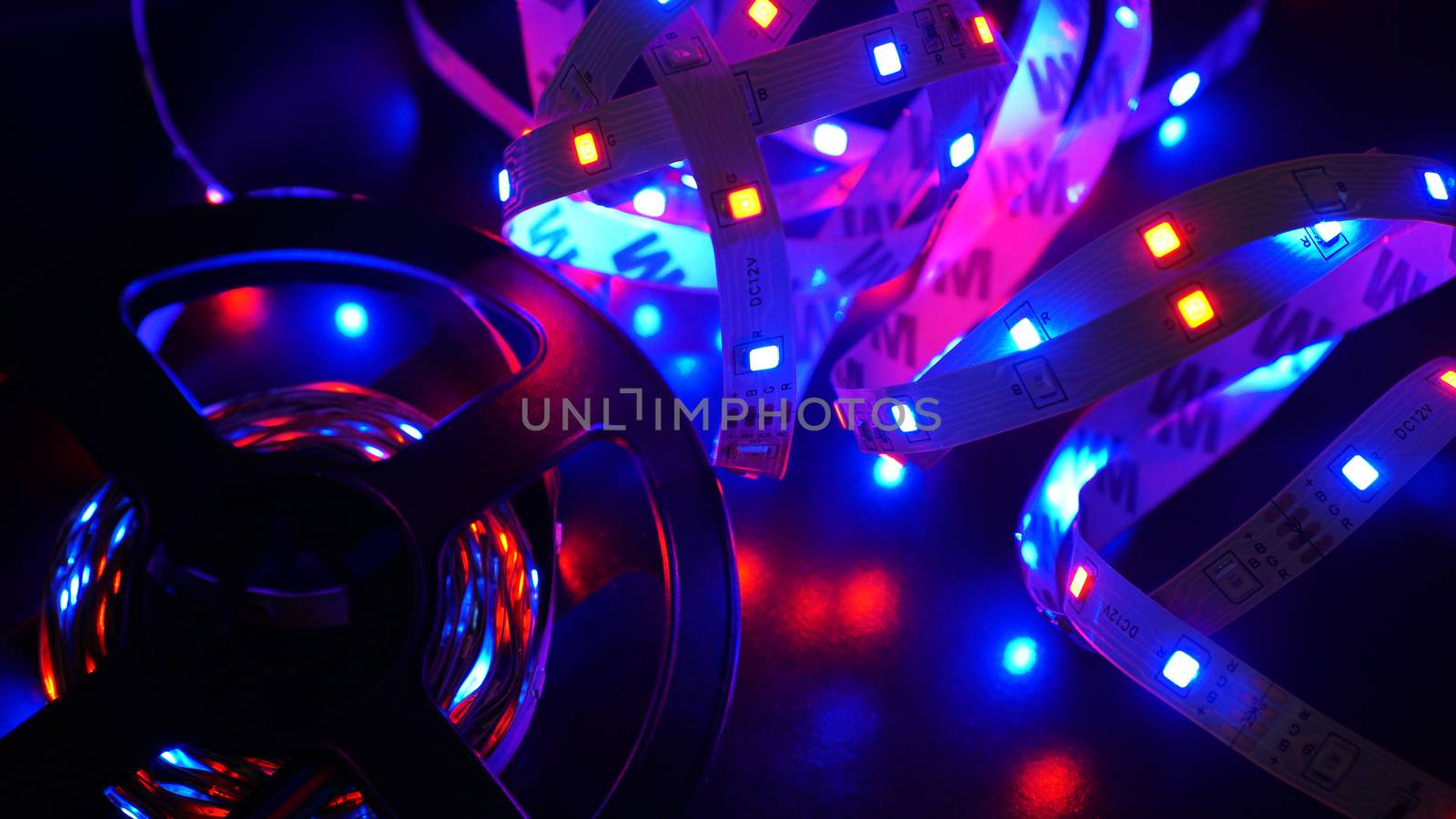 Led stripe and diod coil - purple light on black background