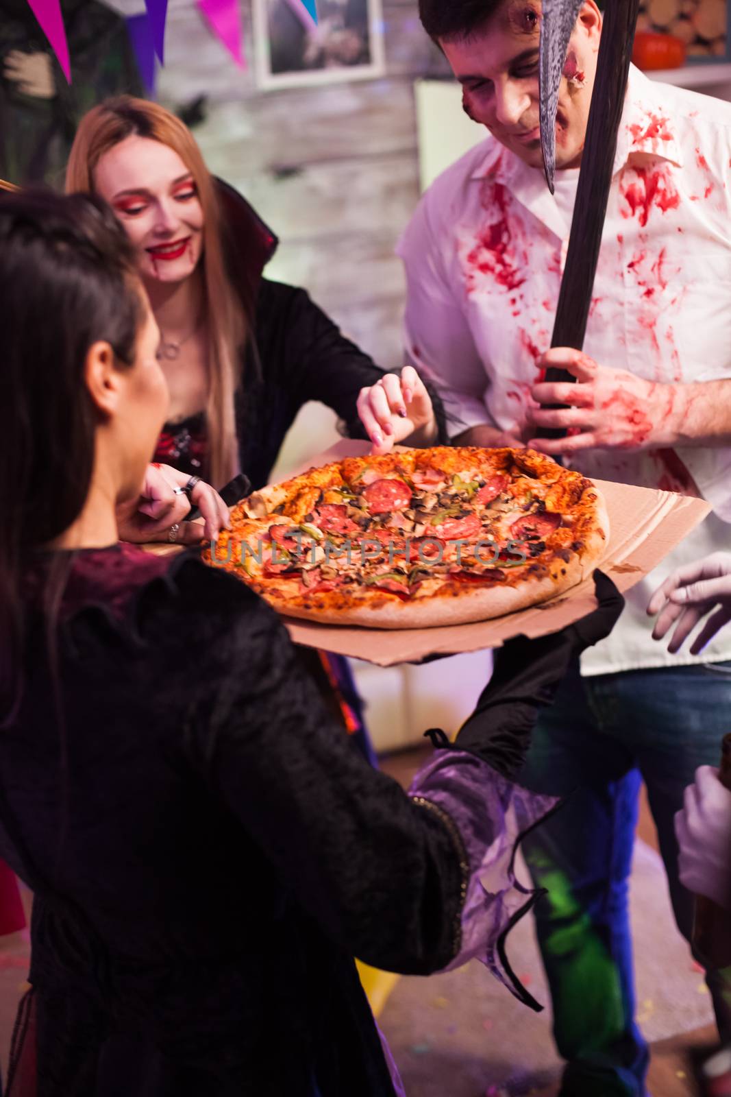 Excited group of friends about pizza by DCStudio