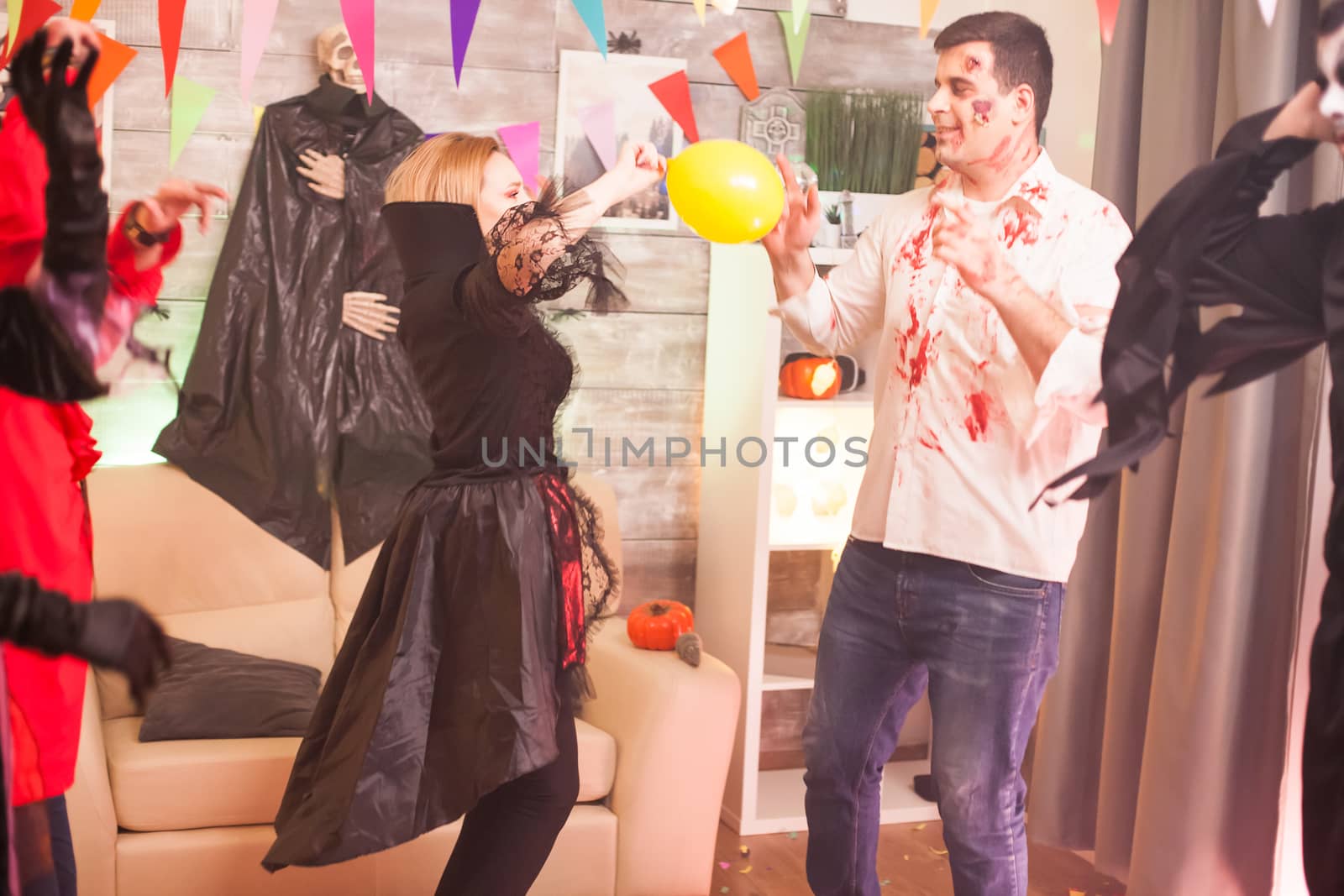 Bloody zombie playing with a balloon by DCStudio