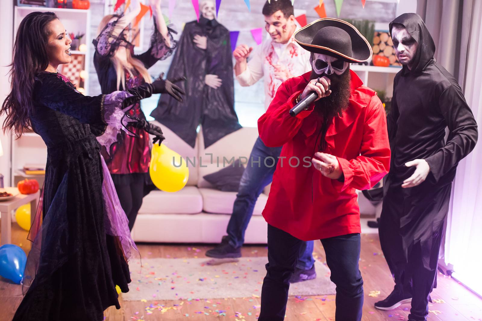 Medieval pirate with good voice singing at halloween celebration.