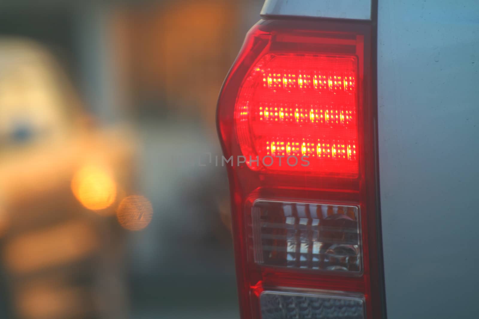 Warning light side back car evening, Brake lights of car back, Warning hazard lights car on the road traffic jam