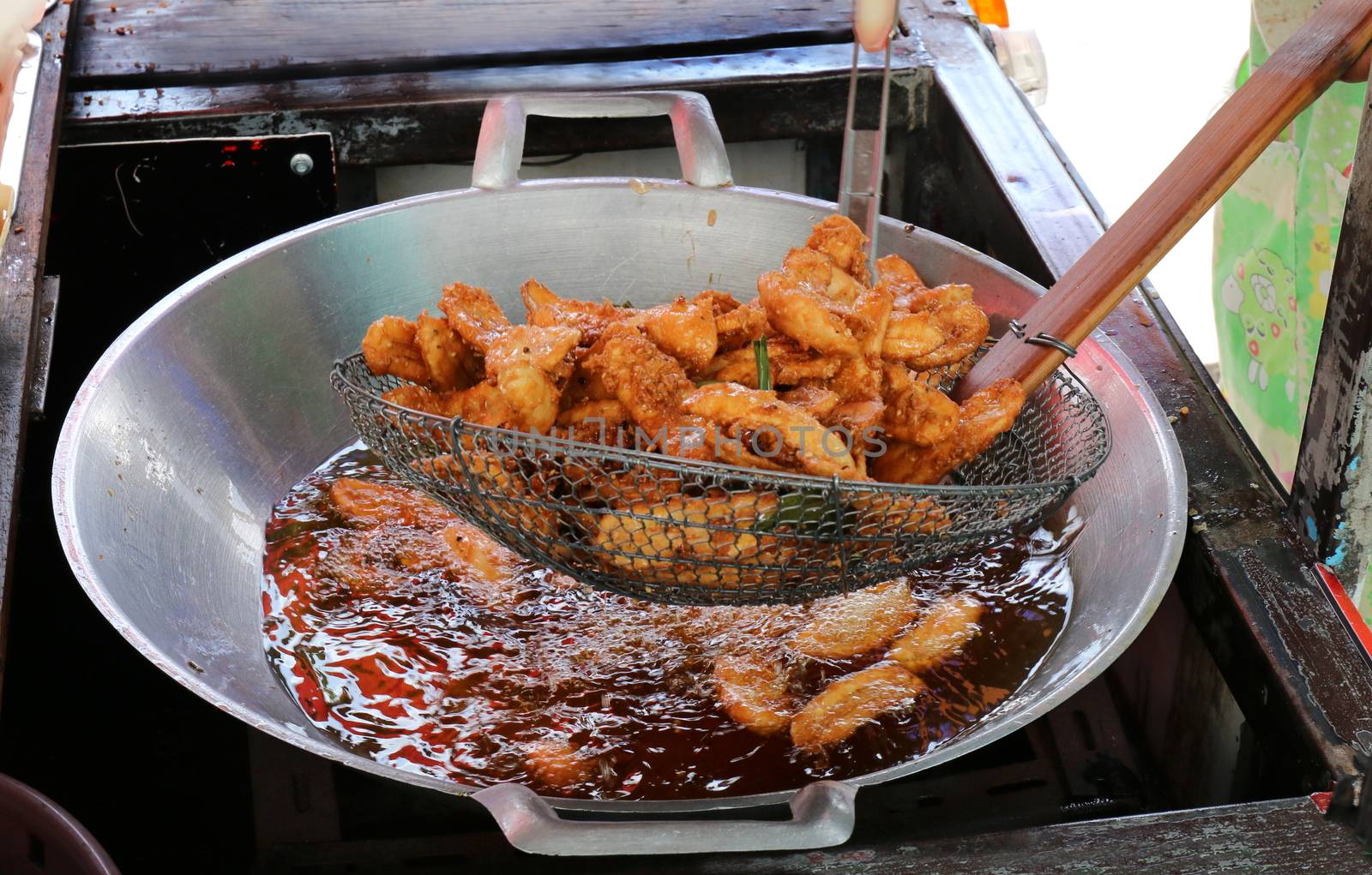 banana fried in a pan heating oil, banana fried of thai asian easy food street