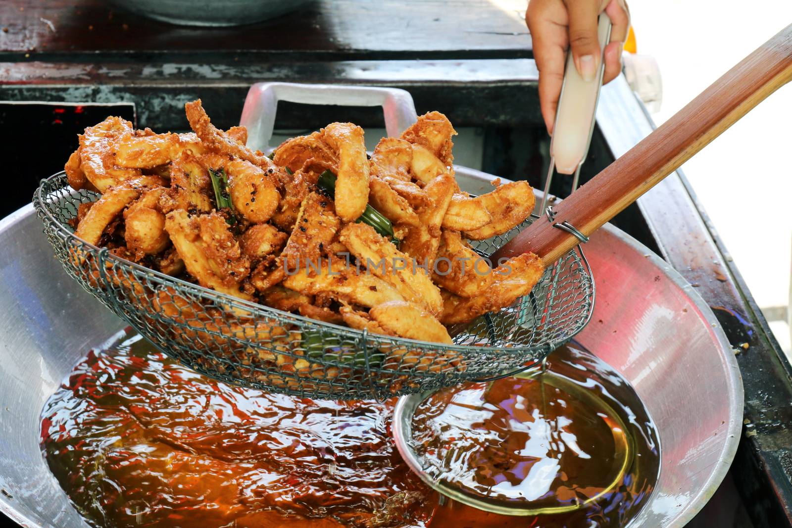 banana fried in a pan heating oil, banana fried of thai asian easy food street
