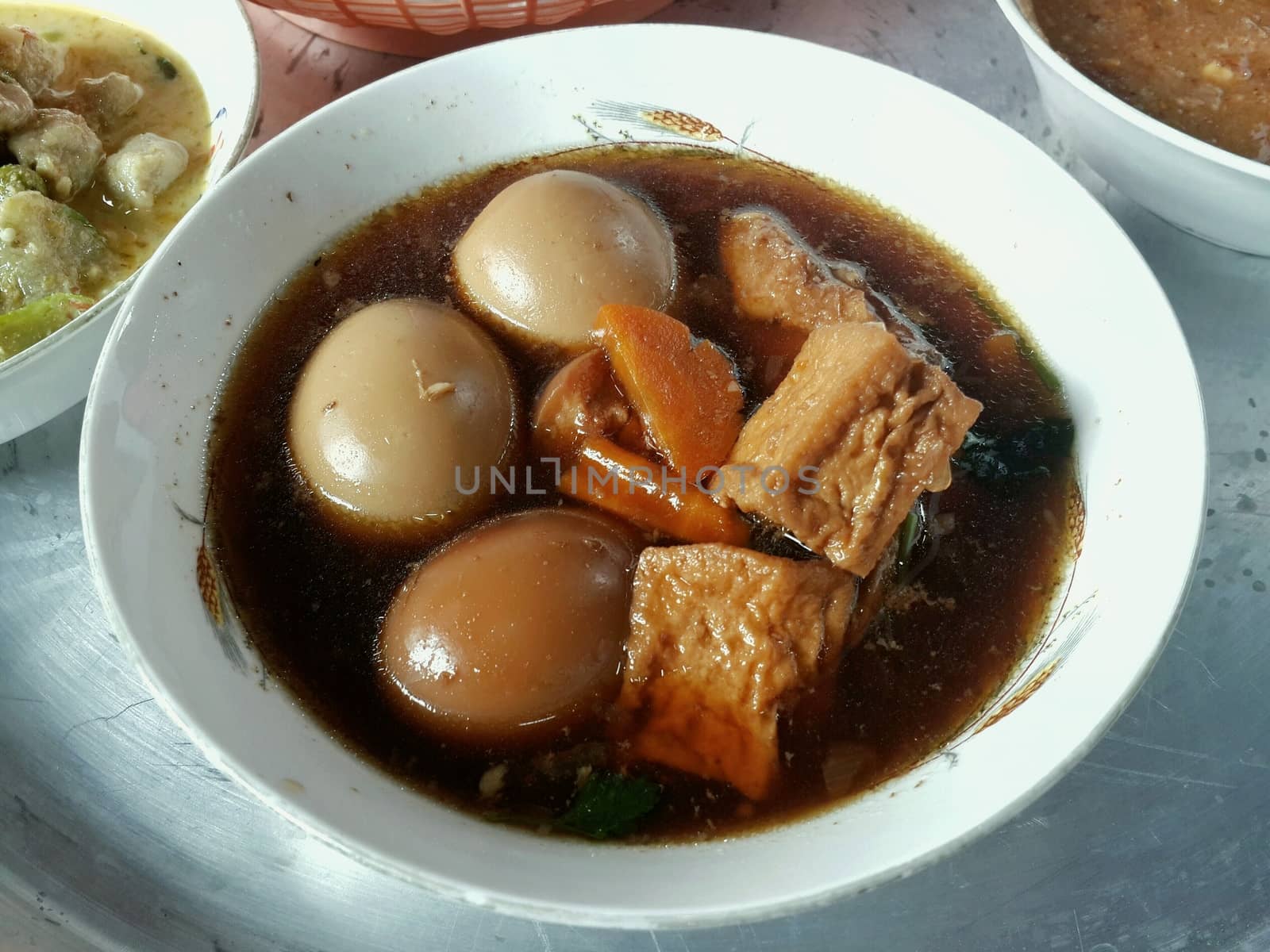 Tom kai Palo (thai word) Boiled egg stewed in bow, asia food countryside