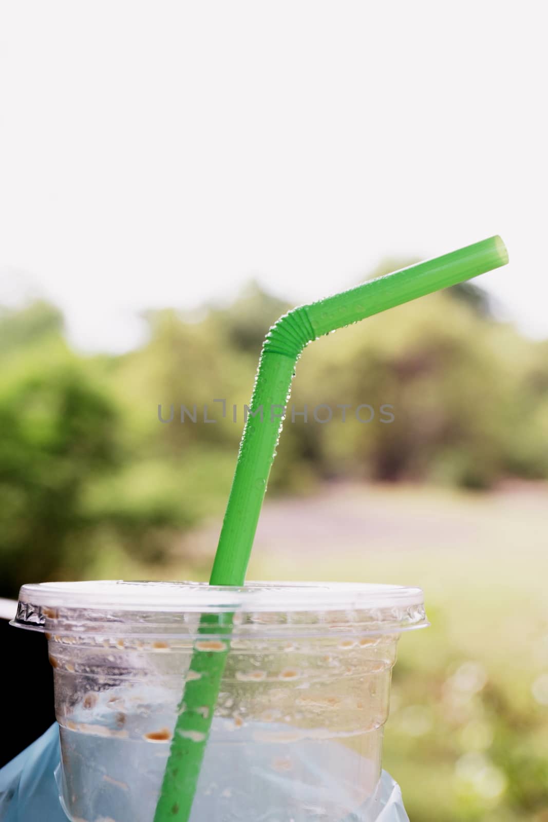 straw green tube refreshed with condensation of water ice, fresh lifestyle by cgdeaw