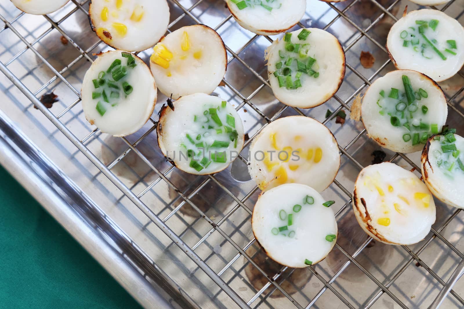 Ka Nom Krok (Thai word), Kind of Thai sweetmeat, Thai dessert, Coconut pudding, Coconut Rice Cake, Thai street dessert food grilled coconut-rice pancakes
