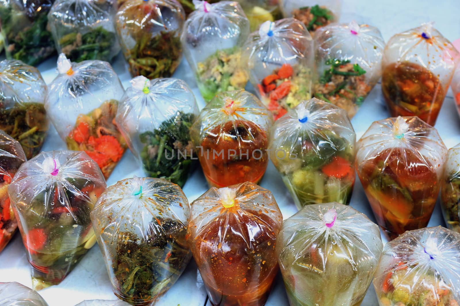 khawkang, kangthung, khangtook (thai word) bag of curry, thai street foods in bag at market countryside