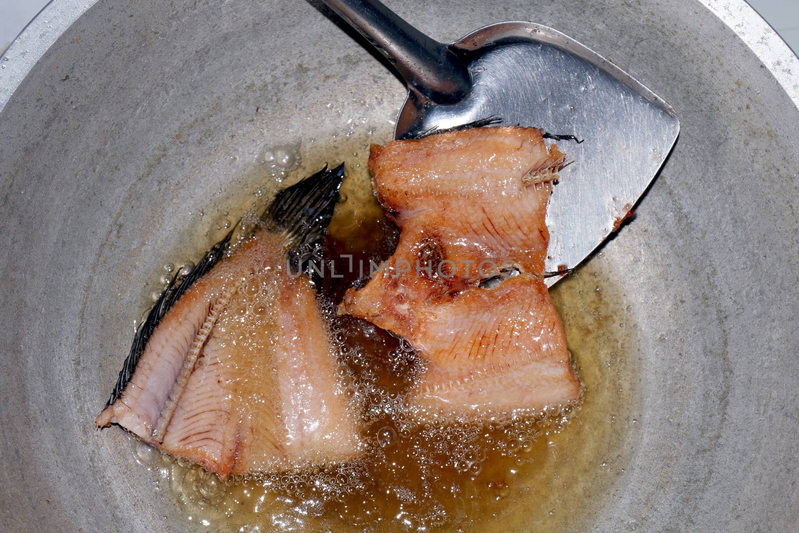 Fried fish pieces in hot oil pan, Fried fish for diet, Fish cutting Portion slice fried in oil cooking pan is food protein diet health