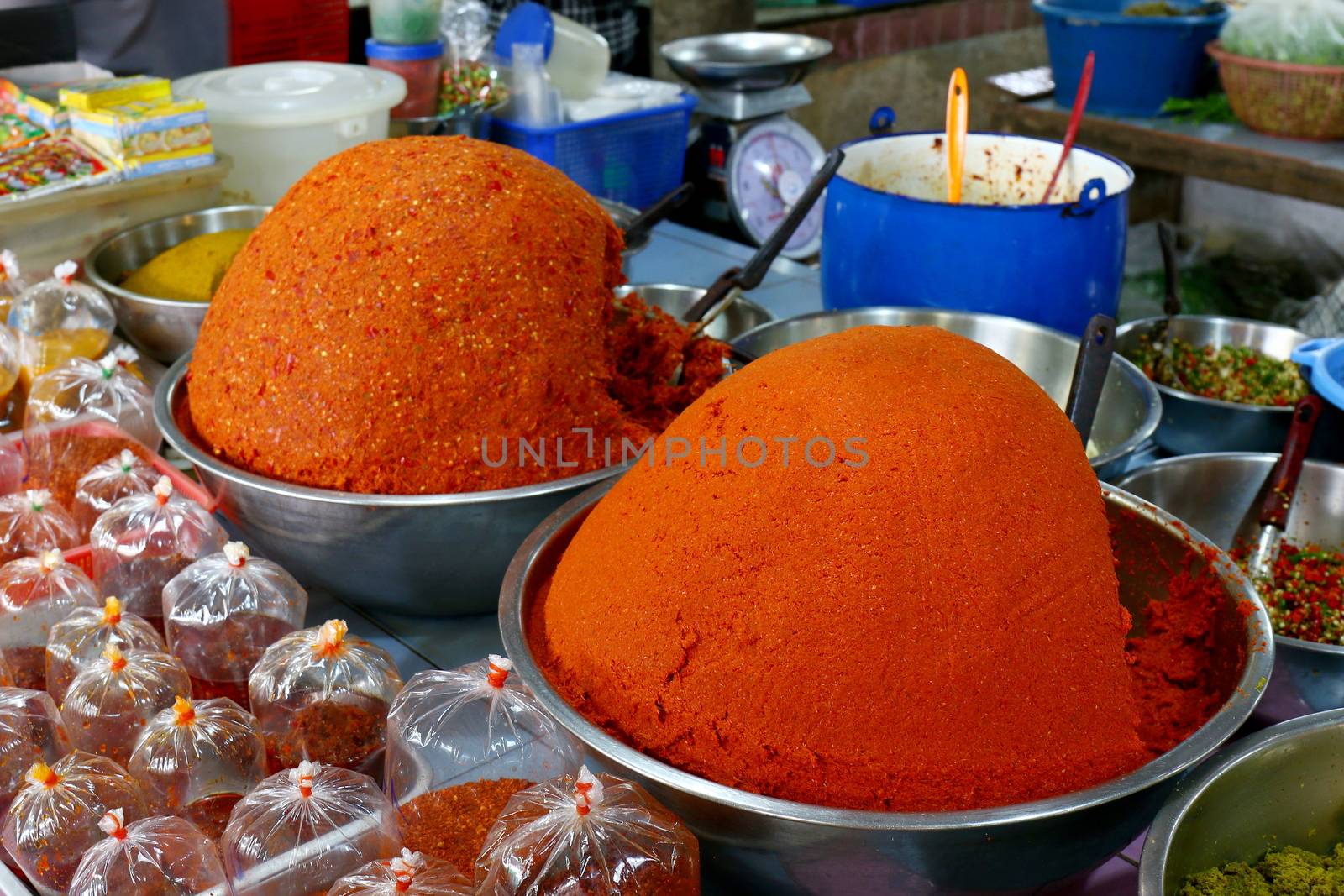 Curry in the bazaar, Spicy Curry pile, Curry red orange colorful spice market, Traditional spices hot food in local bazaar in Thailand (Selective Focus)
