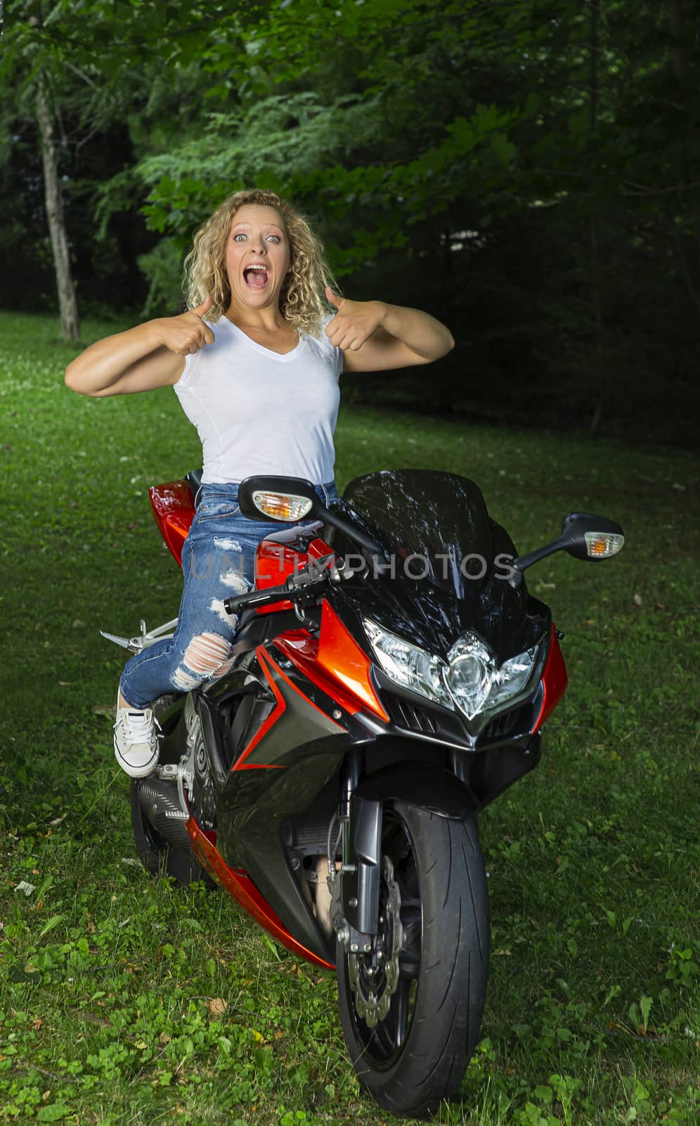 Happy girl on a biker by mypstudio