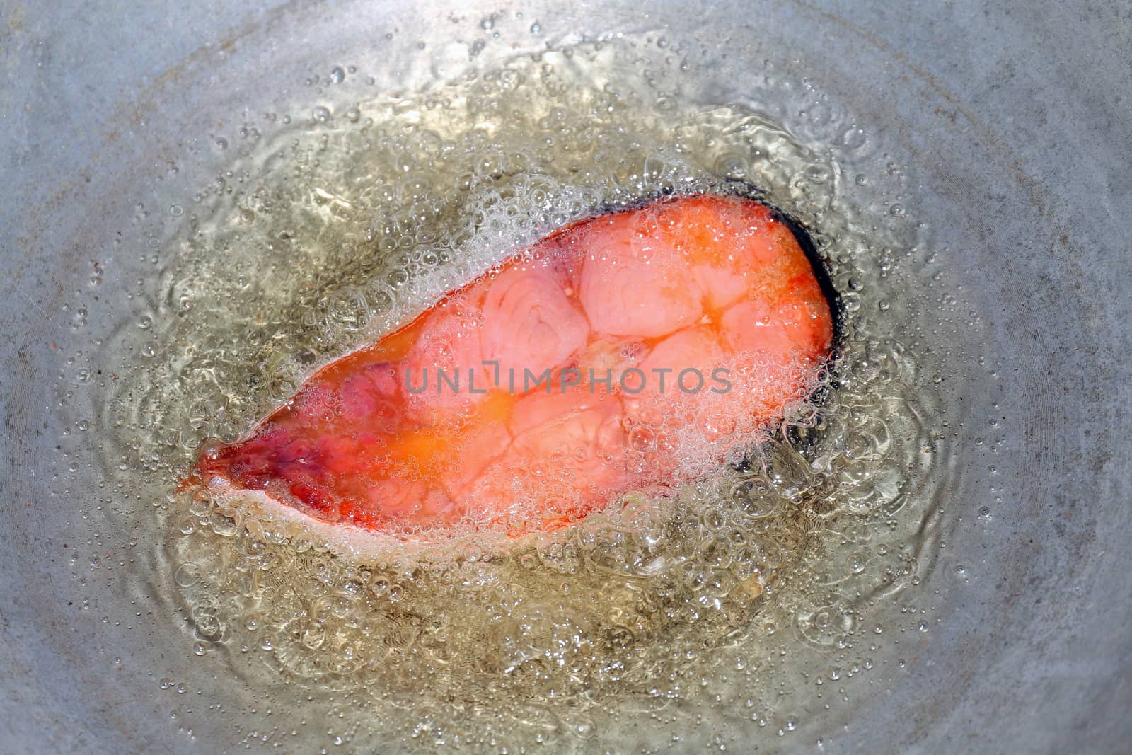 Fish raw slice piece cooking, Fried fish pieces in hot oil pan, Fried fish for diet, Fish cutting Portion slice fried in oil cooking pan is food protein diet health