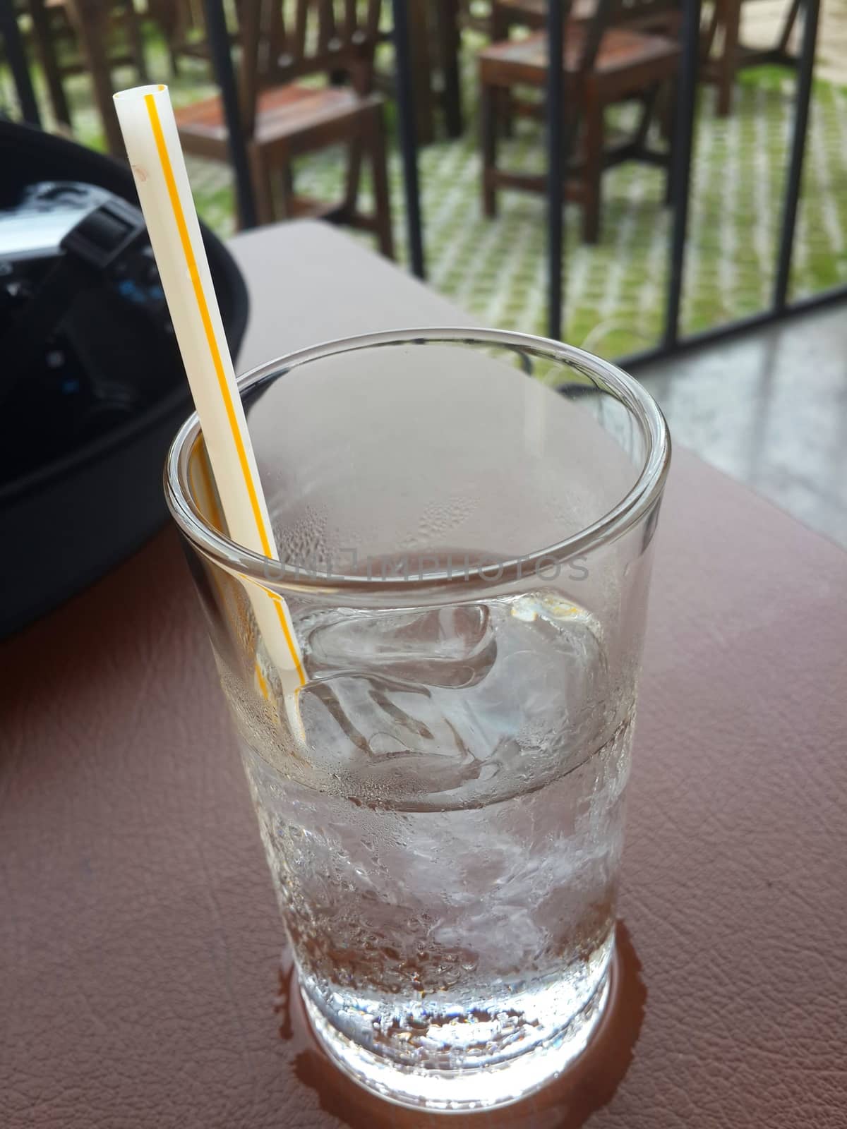 Glass of ice on table, Water clear glass and cold