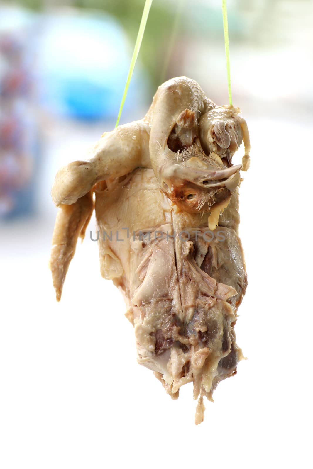 boiled chickens hanging, cooked chicken hanging, chicken bones, chicken frames for hainanese chicken rice It is a local food culture of thailand asia