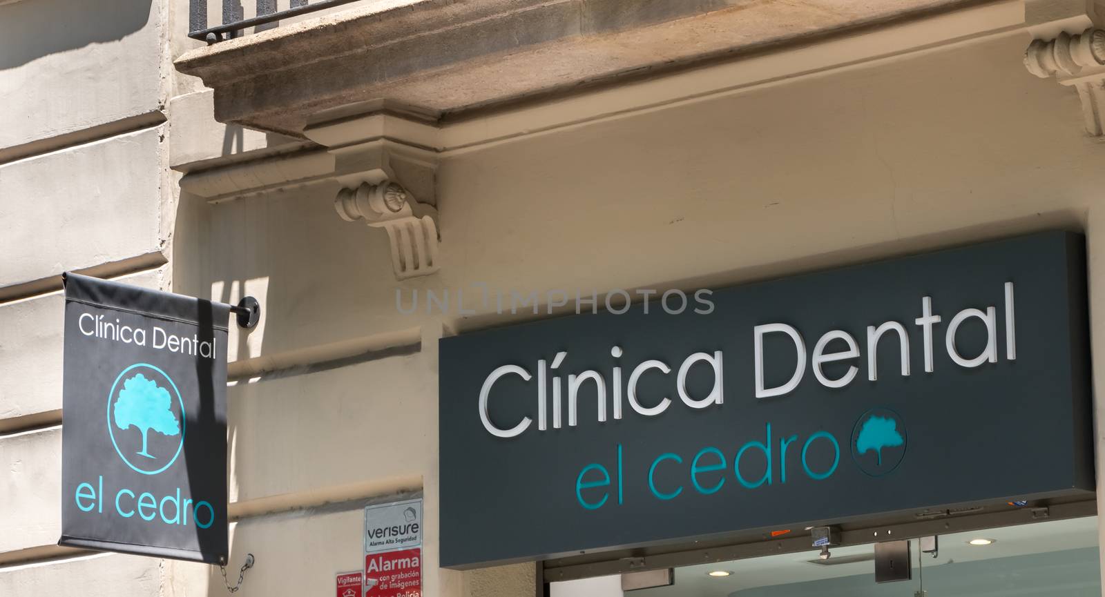 Barcelona, Spain - June 21, 2017: facade of the El Cedro dental clinic in the city center on a summer day