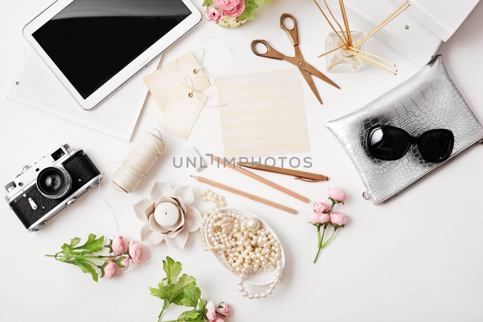 workspace with photo camera, tablet and paper cards on white background. Flat lay, top view office table desk.  