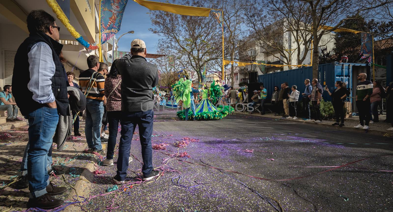 Loule, Portugal - February 25, 2020: dancers parading in the street in front of the public in the parade of the traditional carnival of Loule city on a February day