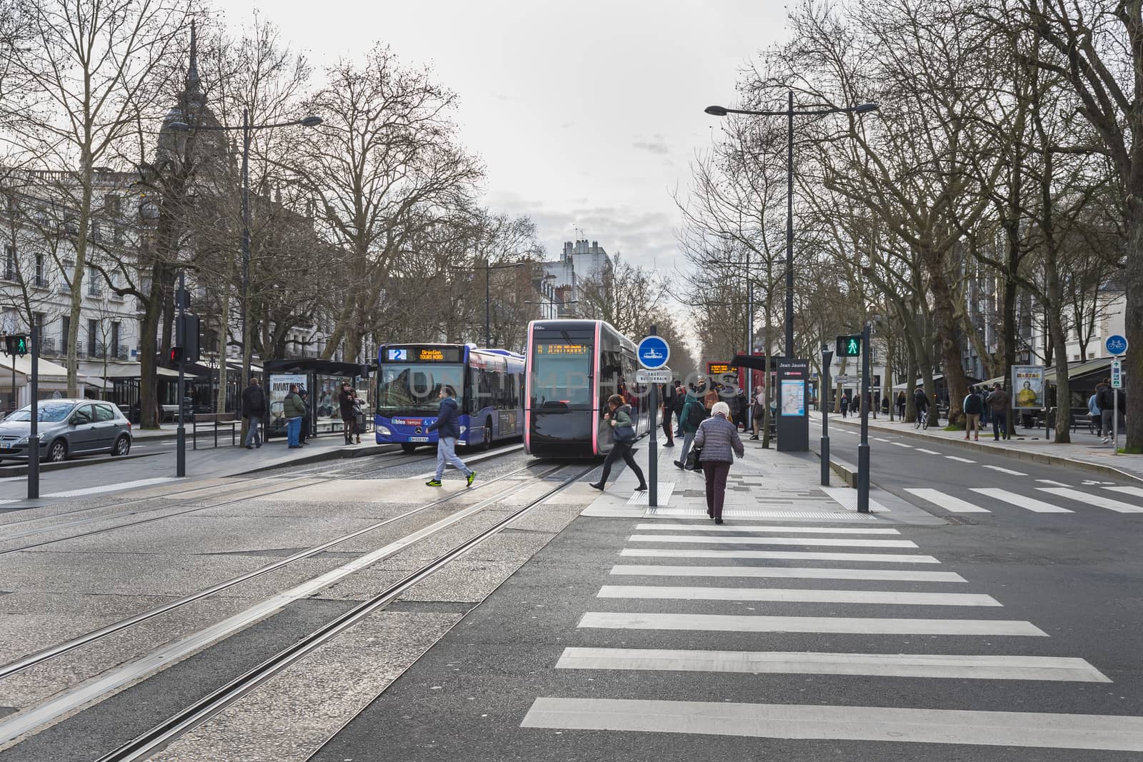 travelers in the Jean Jaures electric tram and bus station in To by AtlanticEUROSTOXX