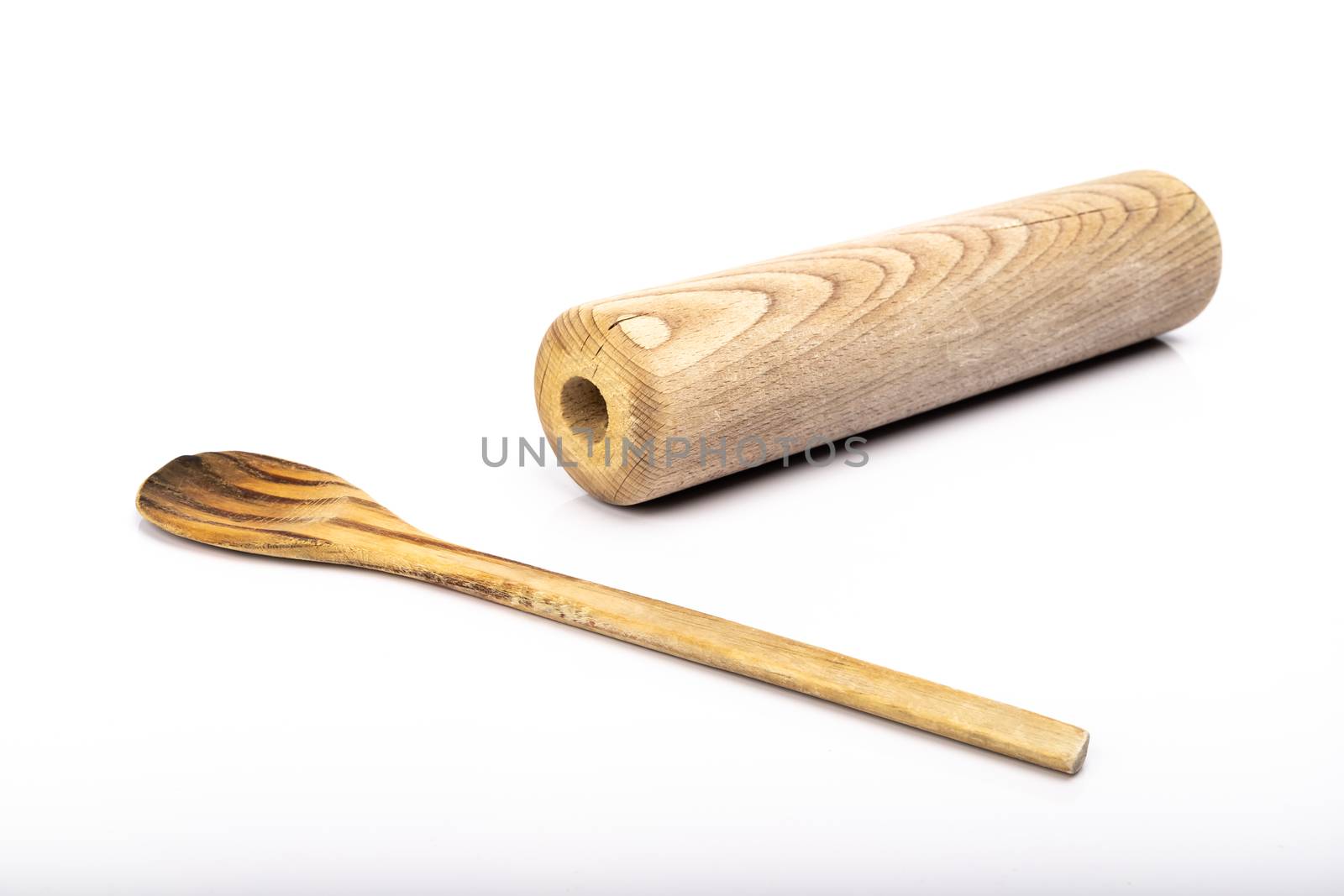 wooden spoon and rolling pin on white background in studio