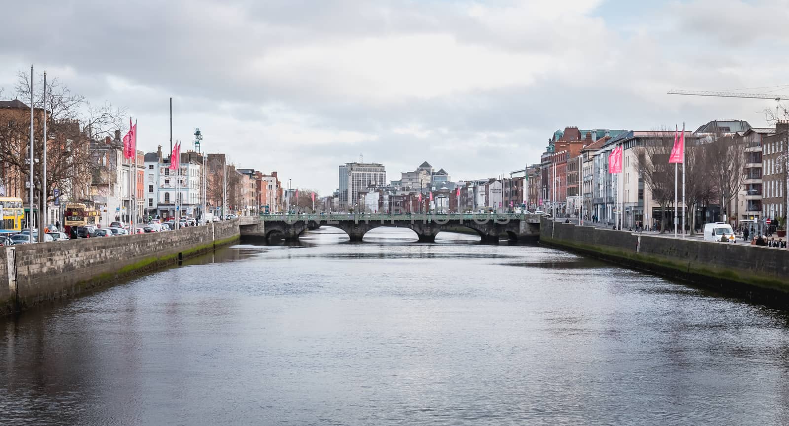 Dublin, Ireland - February 16, 2019: mix of modern and old architecture along the Liffey River in the city center on a winter day