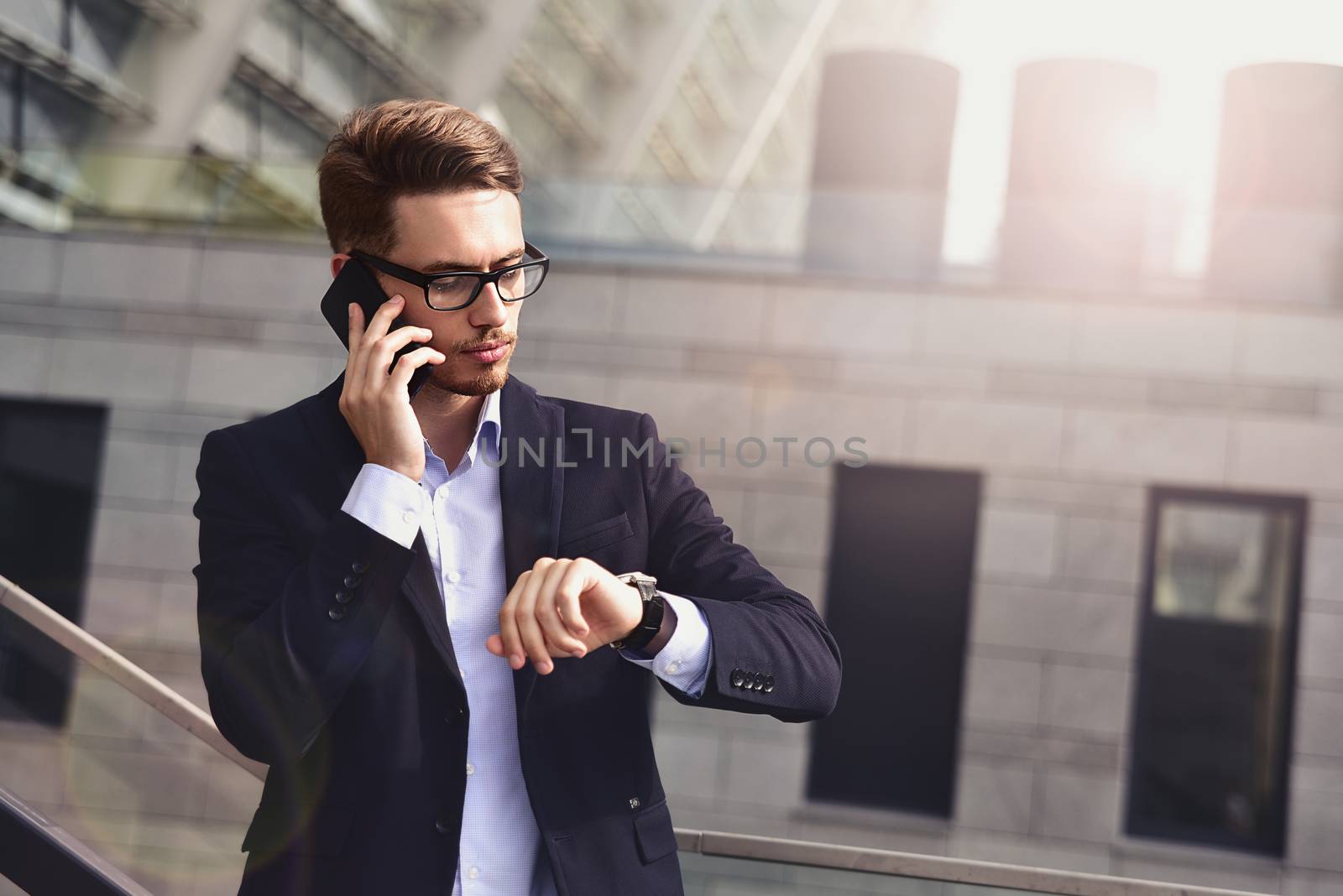 Successful caucasian businessman in elegant suit stand at street in the city.