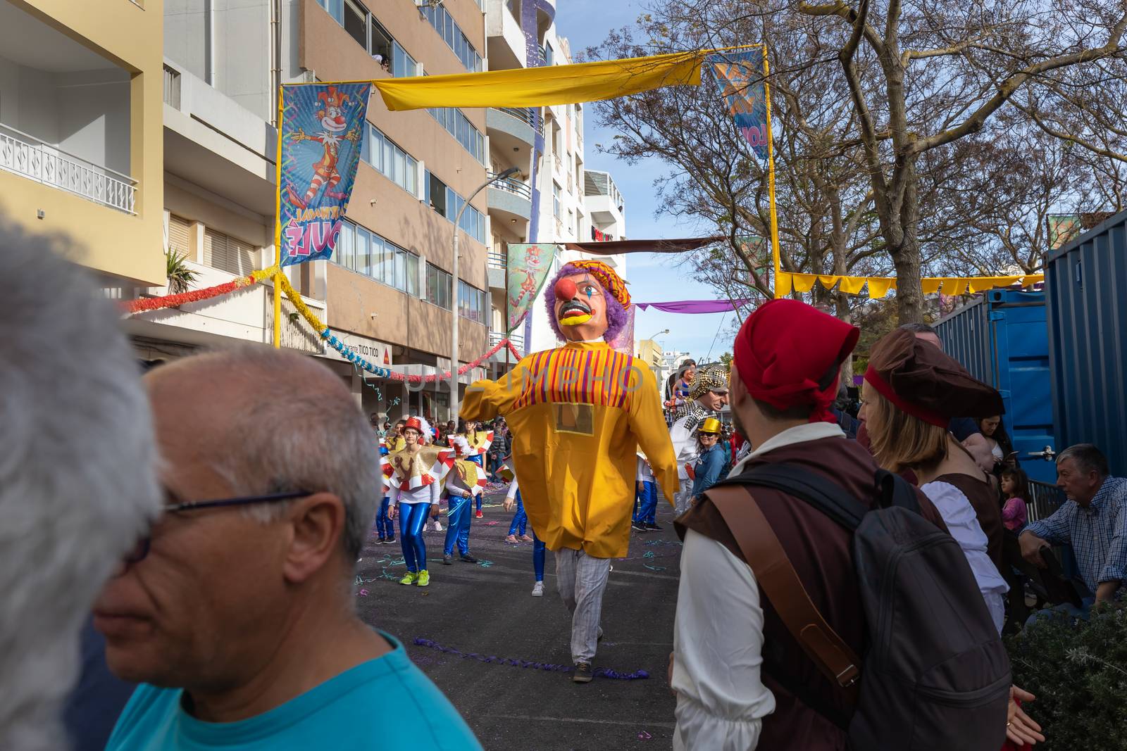 Loule, Portugal - February 25, 2020: Man disguised as a giant in the street in front of the public in the parade of the traditional carnival of Loule city on a February day