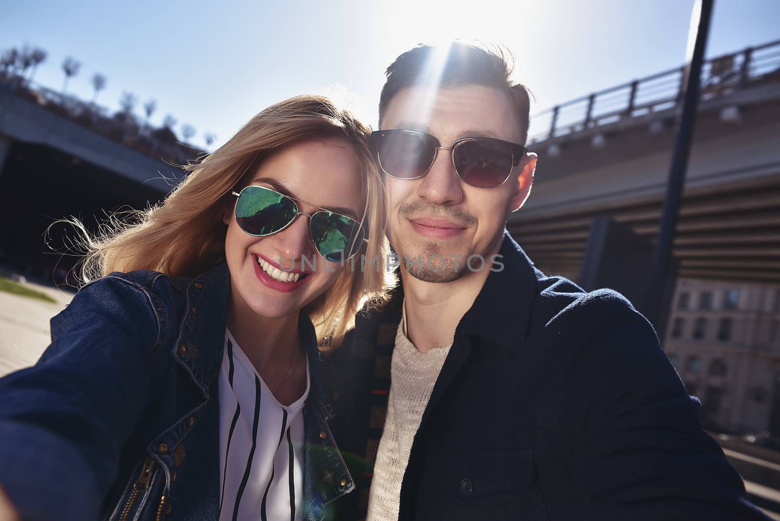 Happy young couple in love takes a selfie portrait