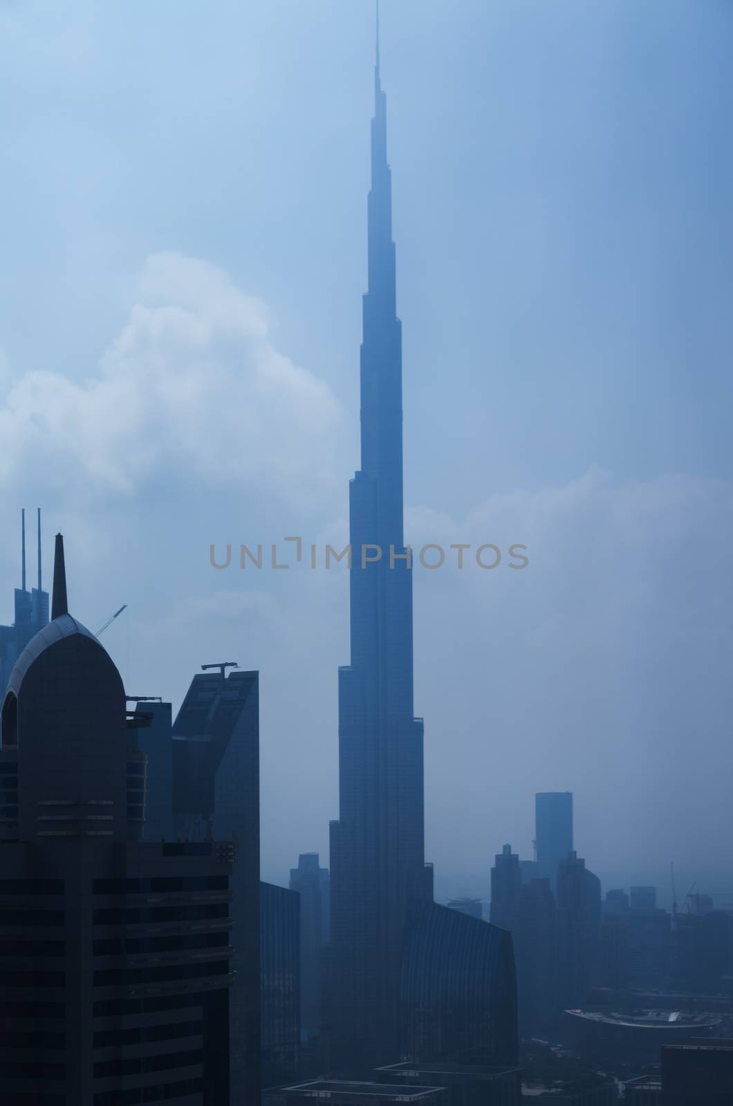 DUBAI, UAE - JANUARY 23, 2016: Vertical night panorama of Burj Khalifa tallest building in the world 829.8 m. Dubai Burj Khalifa, United Arab Emirates
