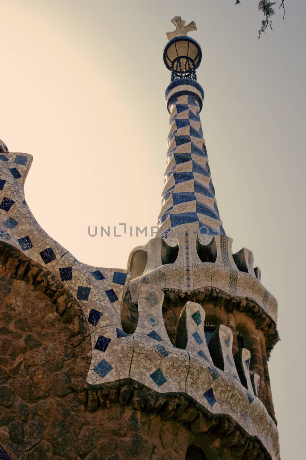 BARCELONA, SPAIN - AUGUST 24, 2012. Catalunya, The entrance of Park Guell with the famous mosaics of Antonio Gaudi located on Carmel Hill, Barcelona, Catalonia,Spain.