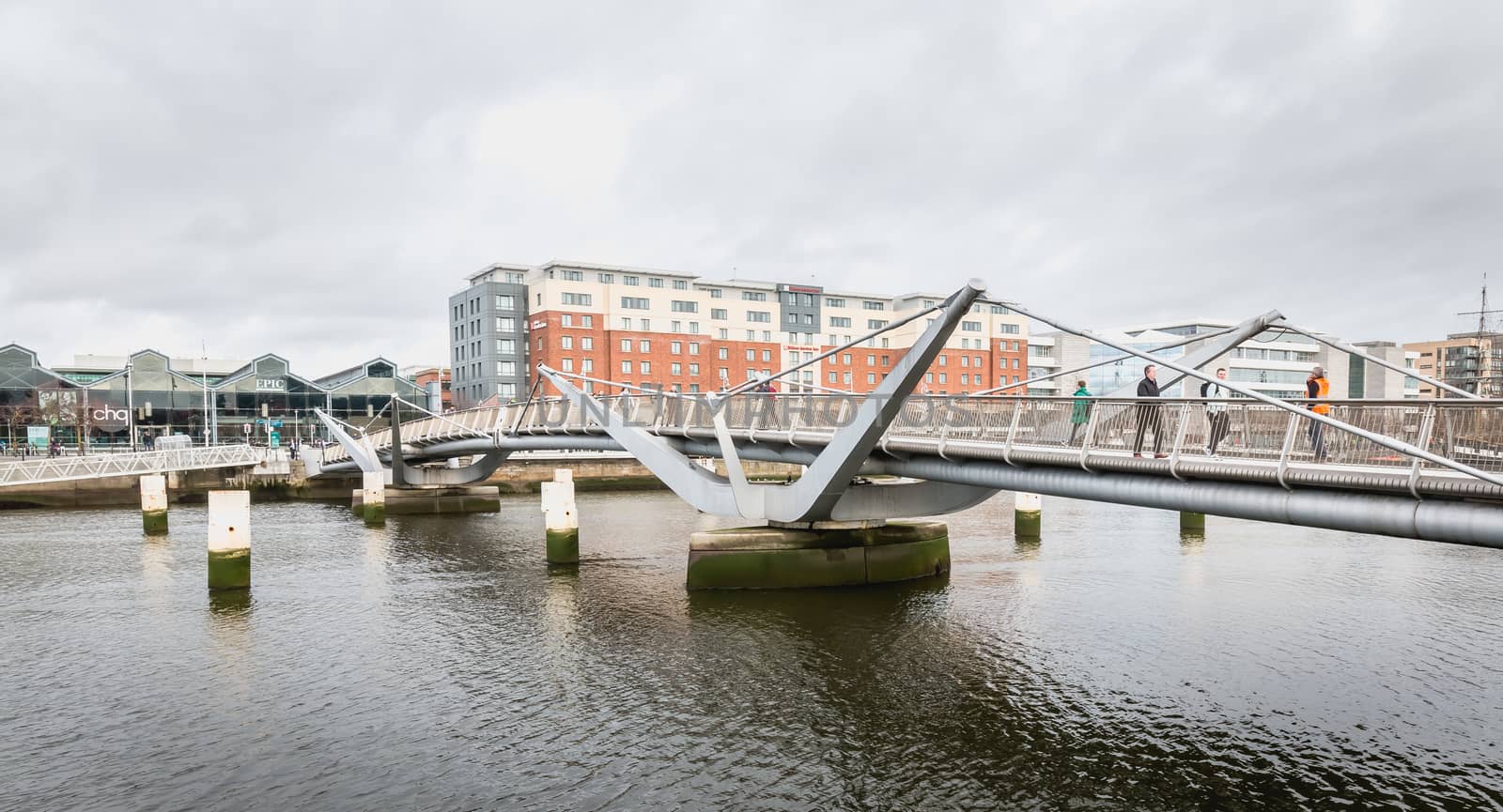 Dublin, Ireland - February 12, 2019: mix of modern and old architecture along the Liffey River in the city center on a winter day