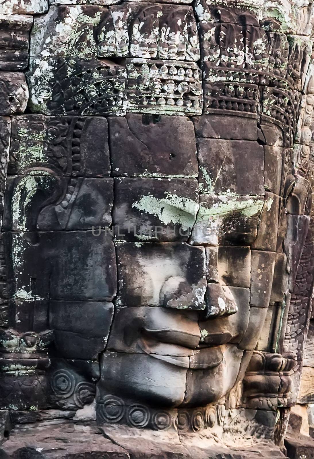 Ancient stone faces of king Bayon Temple Angkor Thom, Cambodia. Ancient monument Khmer architecture Kampuchea.