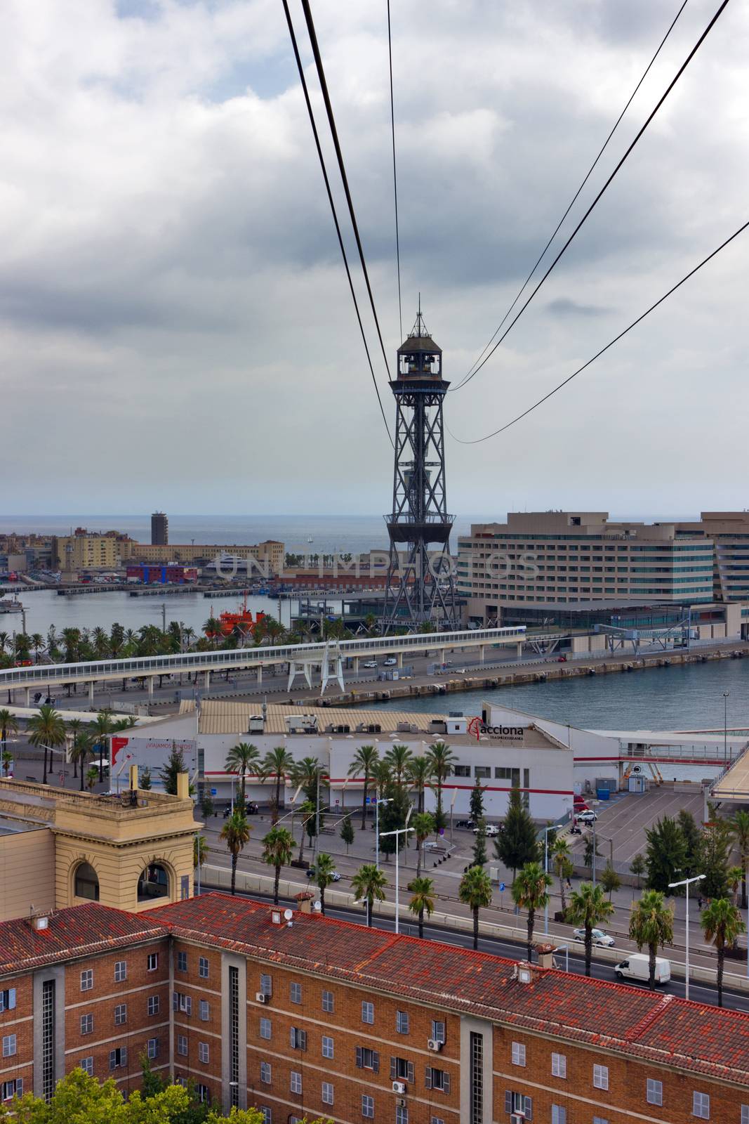 BARCELONA, SPAIN - AUGUST 27, 2012: passenger port of barcelona and tower with a rope-way with an area of sports boats, dock and a shopping area. Catalonia, Spain.