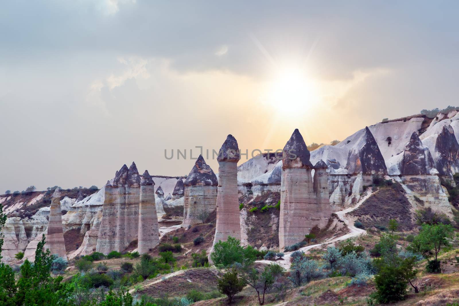 Rising Sun Rock volcanic formations Stone columns, mountain Love valley landscape, Turkey, Cappadocia. Goreme national park.