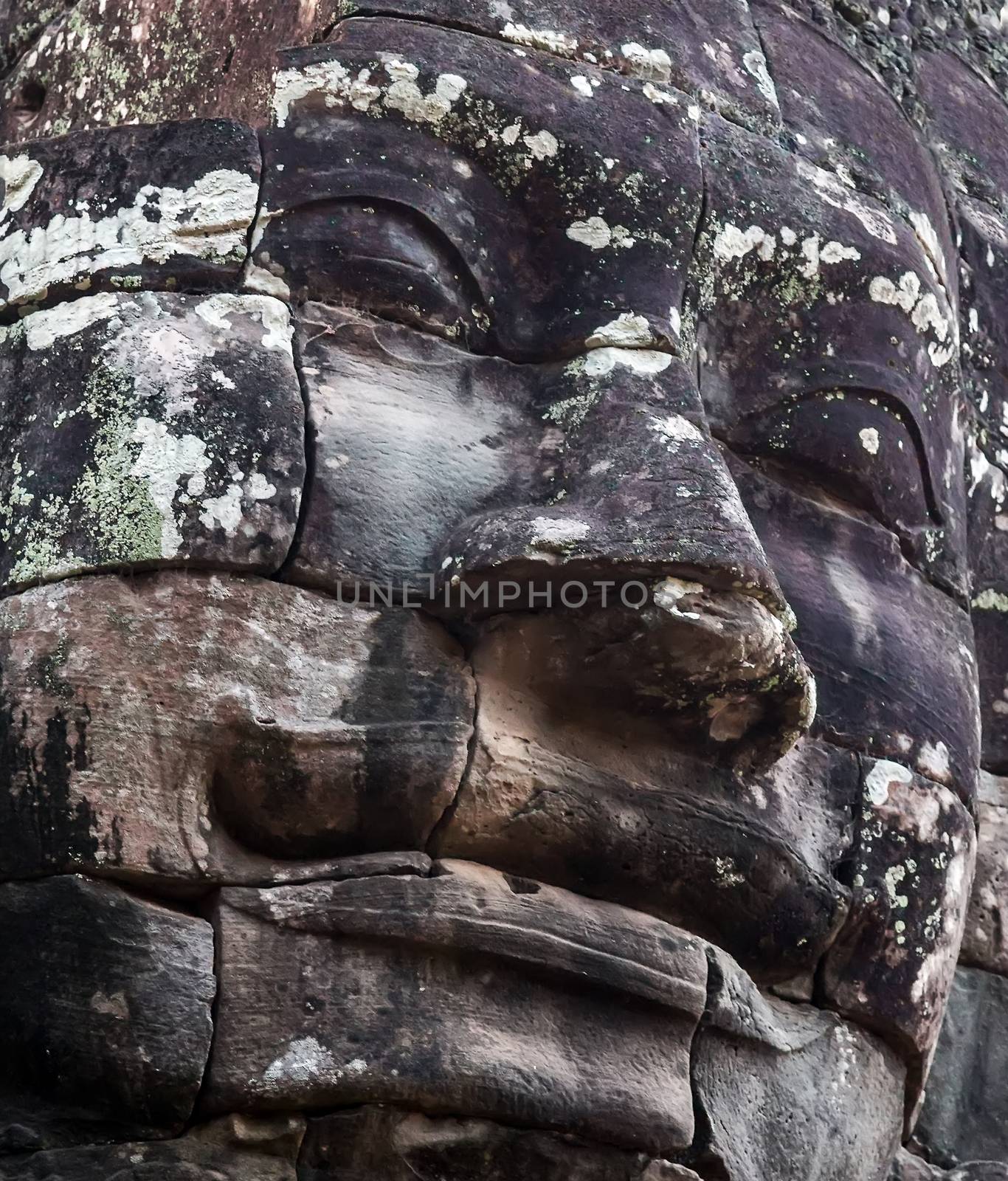 Ancient stone faces of king Bayon Temple Angkor Thom, Cambodia. monument Khmer architecture Kampuchea.