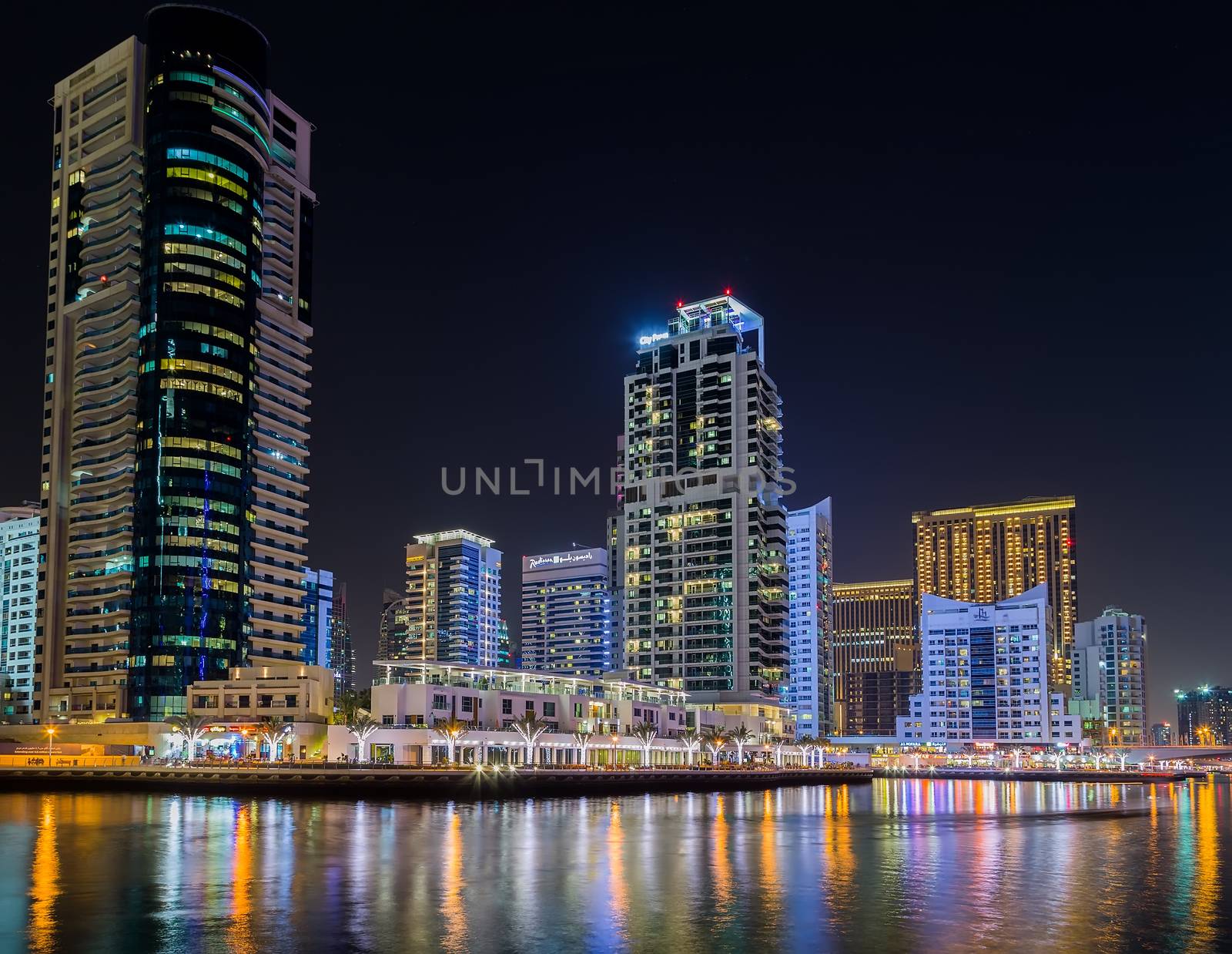 Dubai Marina night skyline Cityscape, luxury new high tech town in United Arab Emirates architecture