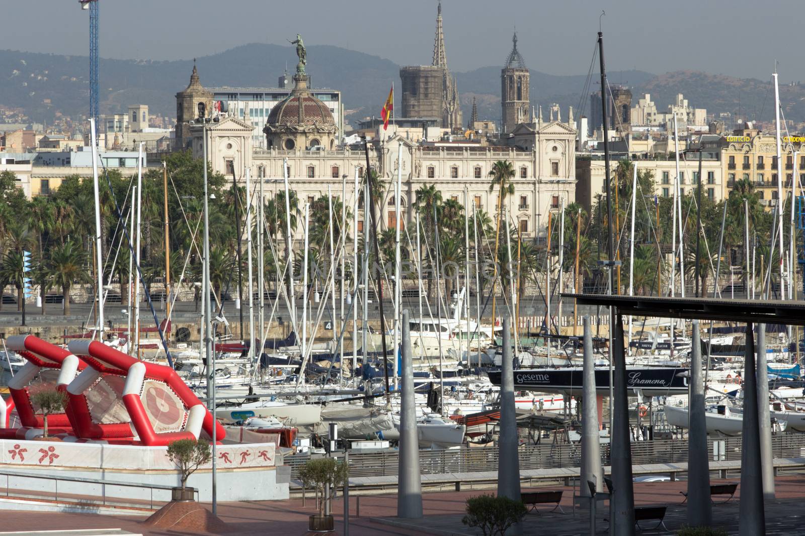 BARCELONA, SPAIN - AUGUST 27, 2012: Port Vell old harbor of Barcelona with an area of sports boats, dock and a shopping area. Catalonia, Spain.