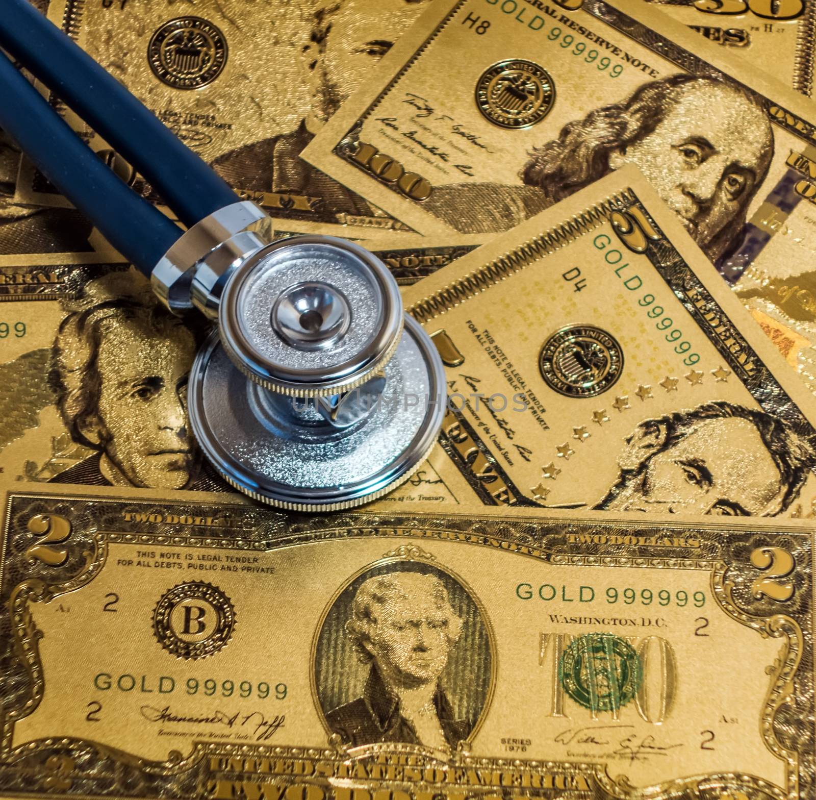 Stethoscopes US currency cash note bill design american dollars banknotes money gold fake background Finance business concept
