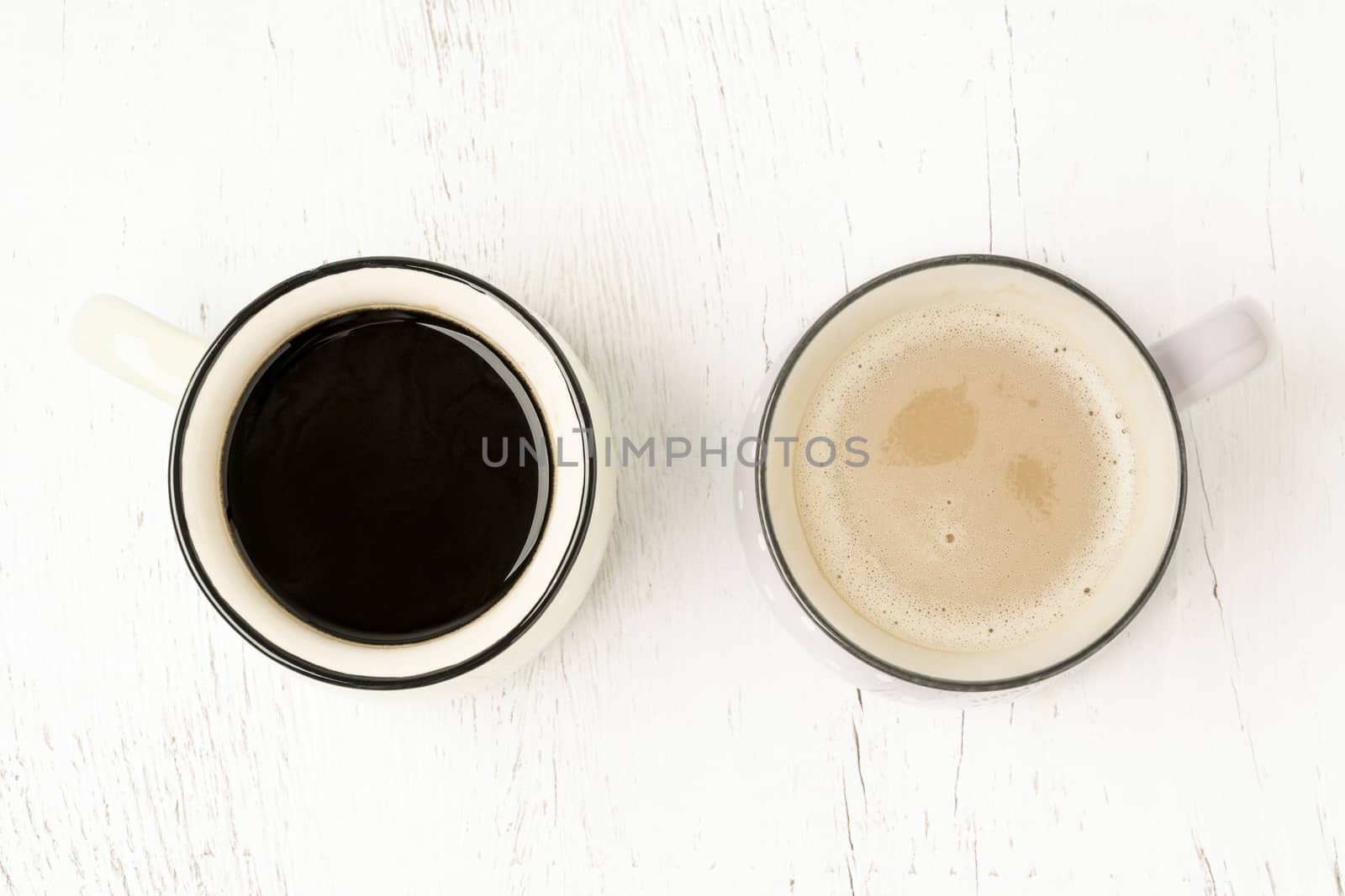 two cup of black Americano coffee and latte on a wooden table