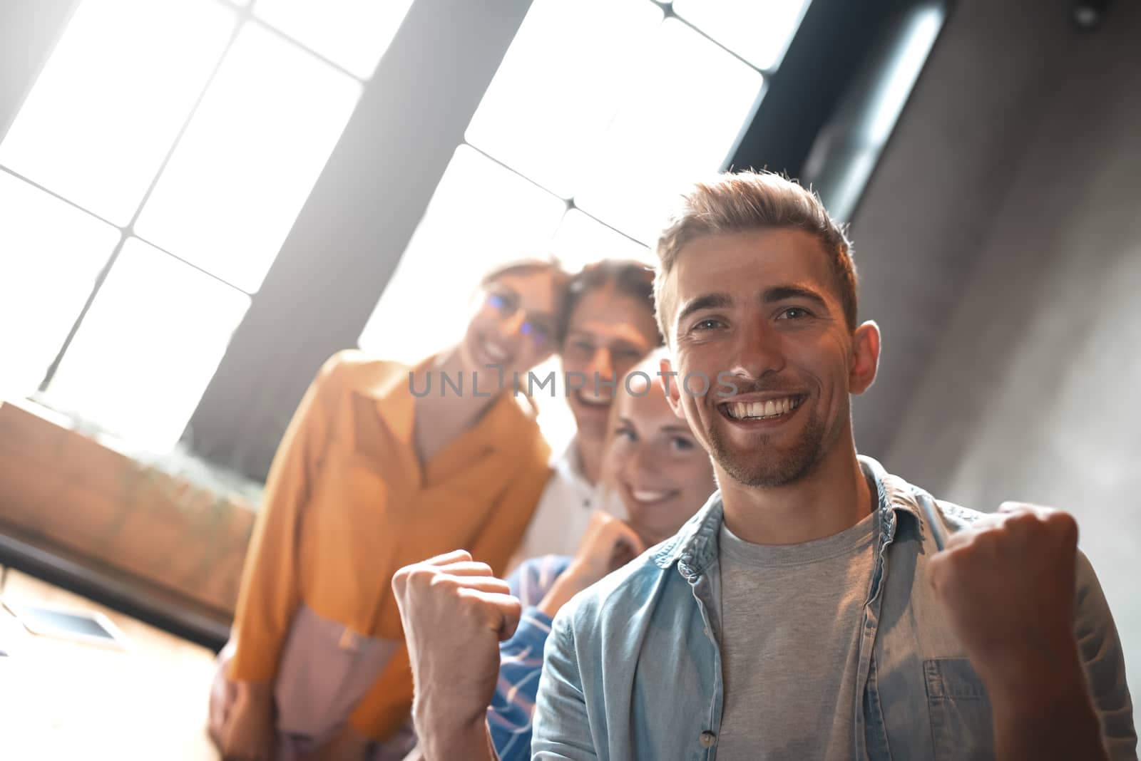 Close up photo of young business people stay together.