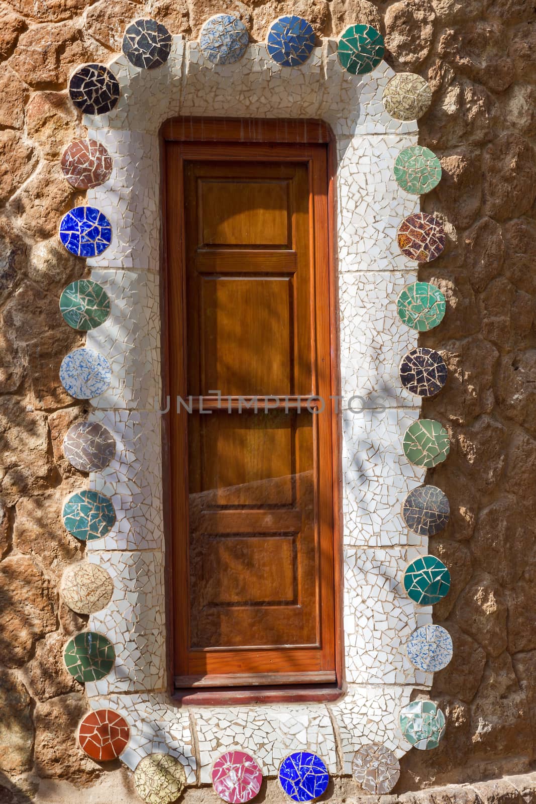 BARCELONA, SPAIN - AUGUST 24, 2012. Catalunya, The entrance of Park Guell with the famous mosaics of Antonio Gaudi located on Carmel Hill, Barcelona, Catalonia,Spain.