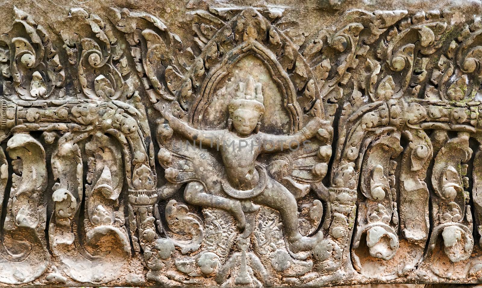 art of ancient Hindu god stone background, detail of the architecture in Bantey Srei temple in the Angkor area, Cambodia.