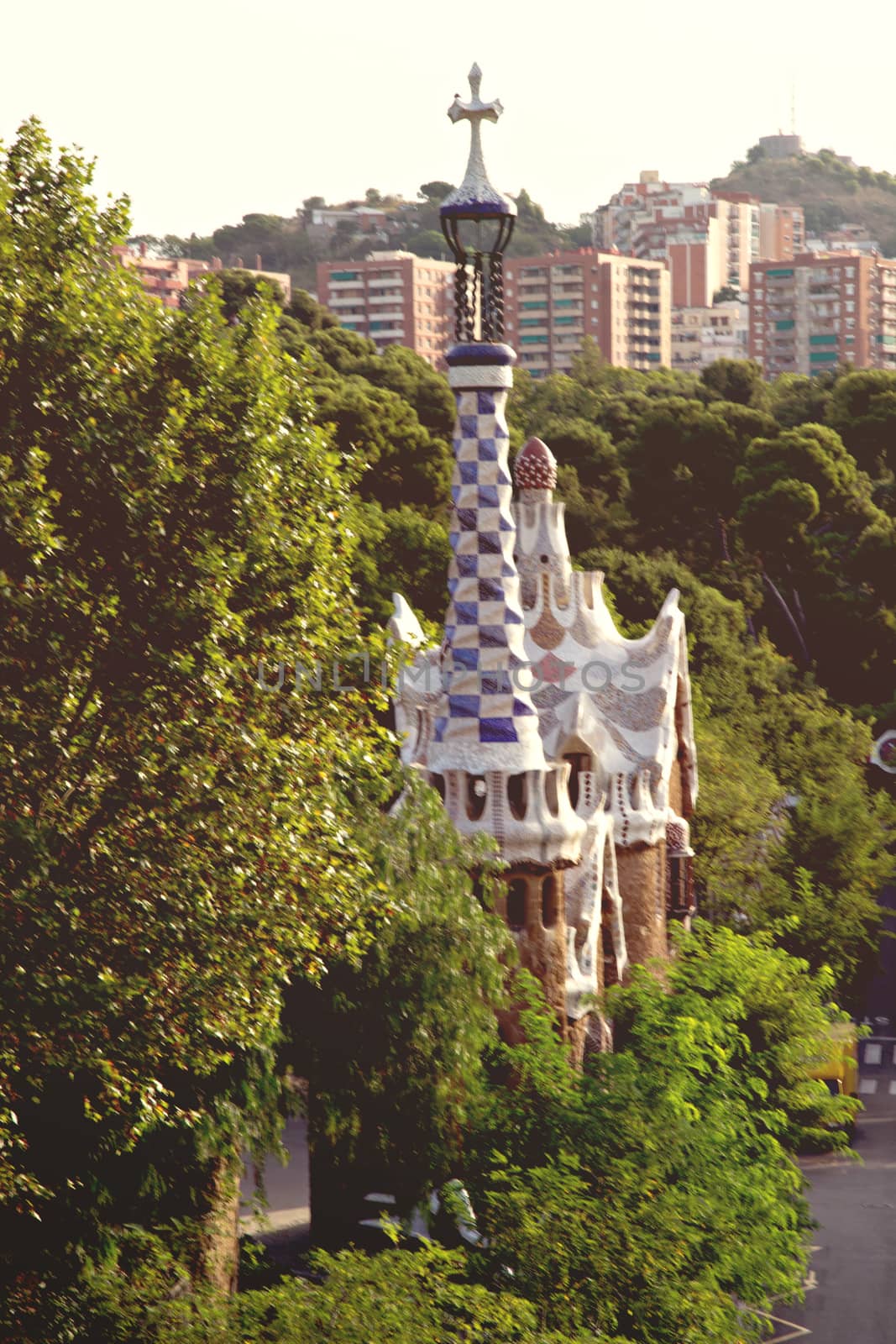 Frame ceramic tile Gingerbread house covered with tile-shard mosaic, Parc Guell designed by Antoni Gaudi located on Carmel Hill, Barcelona, Spain.