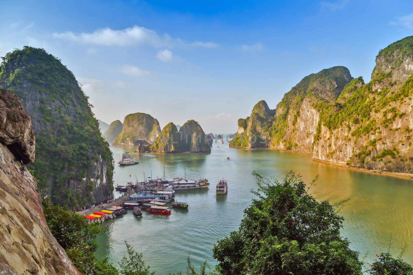 Boat cruise Junks and Floating village in Halong Bay, Vietnam.UNESCO World Heritage Site.