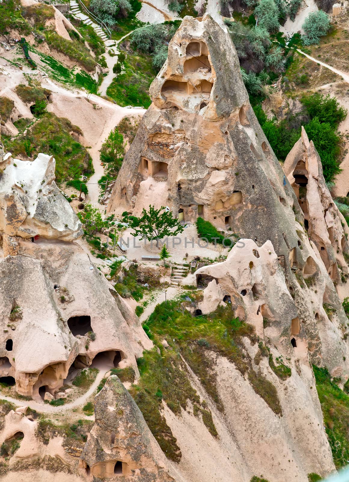 Cave towns in rock formation, Stone houses in Goreme, mountain landscape carved in volcanic tuff Cappadocia, Turkey