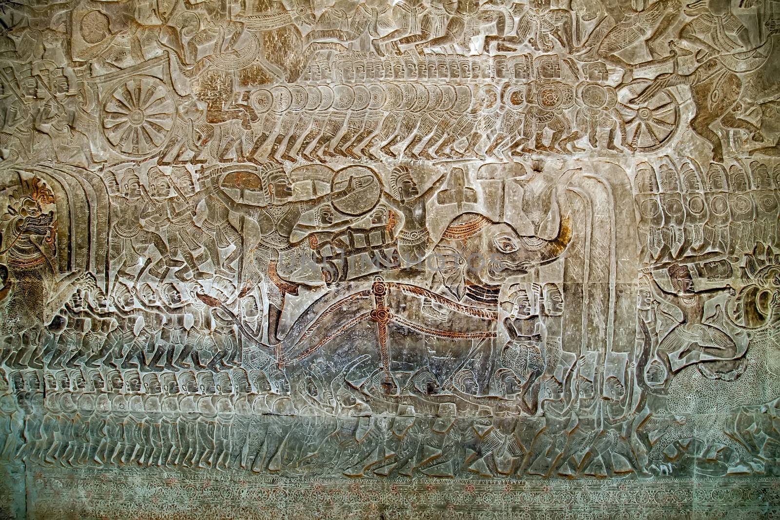 Khmer relief carving of gods fighting demons. Inner wall of the temple of Angkor Wat, Siem Reap, Cambodia.