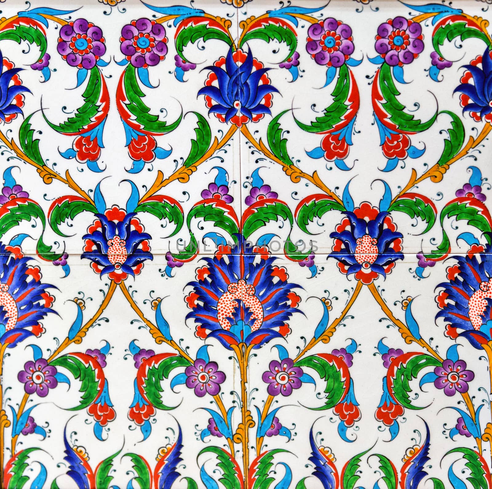 painting a ceramic tile with floral, tile mosaic background, surface textures.